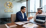 Two men sitting in office