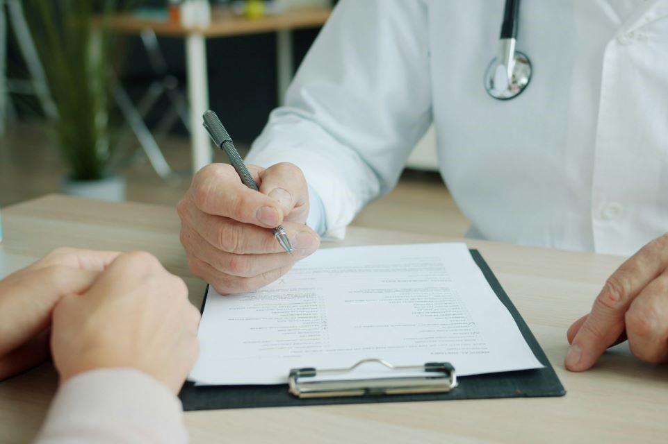 doctor writing a prescription